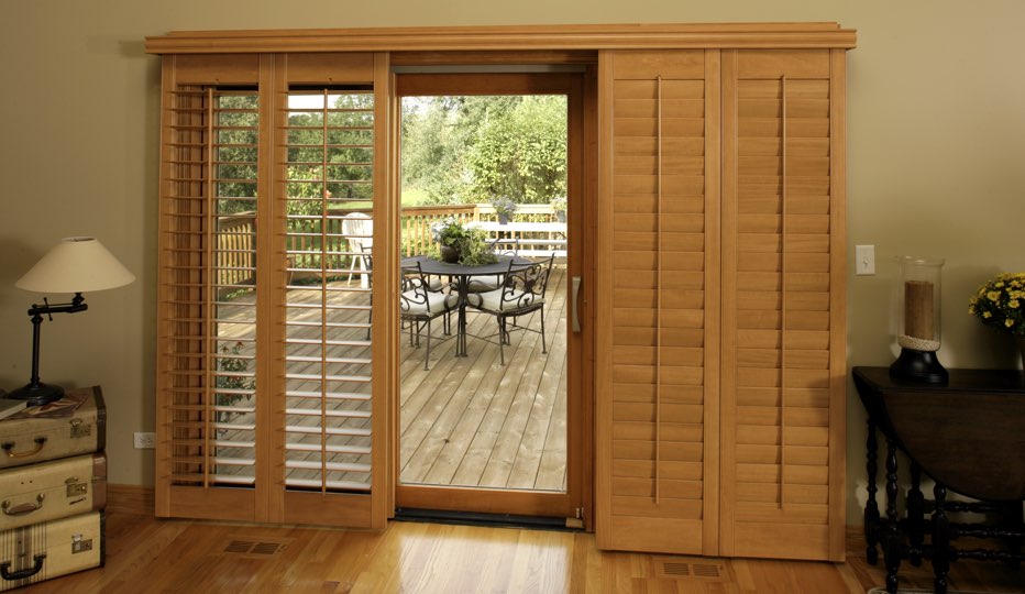 Bypass wood patio door shutters in Phoenix living room